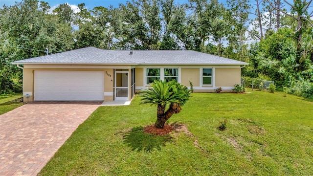 ranch-style home featuring a garage and a front yard