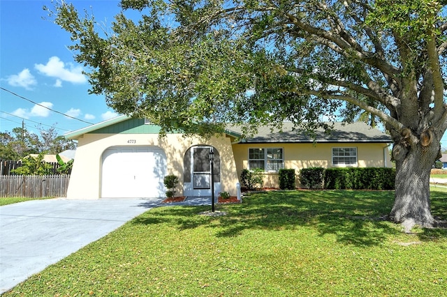 ranch-style home with a front lawn and a garage