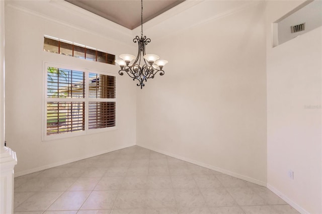 unfurnished room featuring light tile patterned floors, a chandelier, and ornamental molding