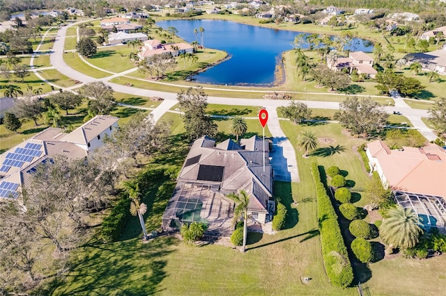 birds eye view of property with a water view