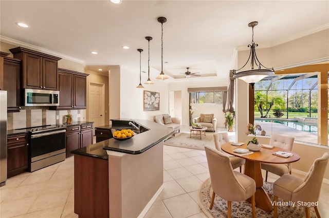 kitchen with ceiling fan, hanging light fixtures, stainless steel appliances, backsplash, and light tile patterned floors