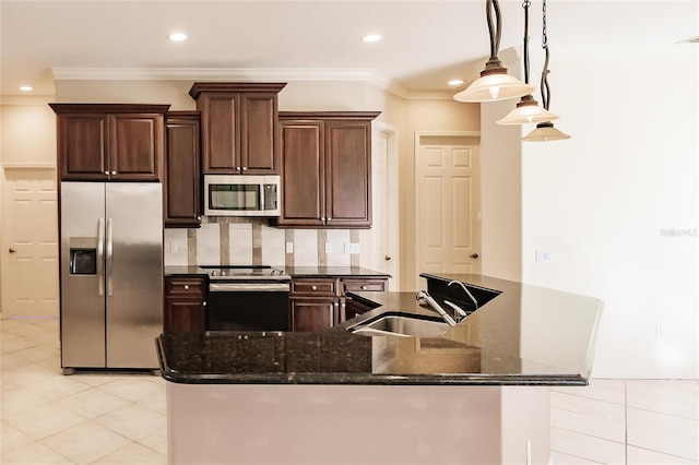 kitchen with decorative backsplash, dark brown cabinetry, stainless steel appliances, sink, and dark stone countertops