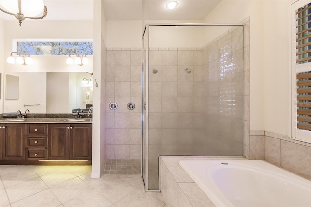 bathroom featuring tile patterned floors, vanity, and independent shower and bath