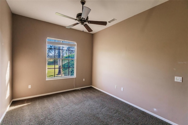 spare room with ceiling fan and carpet floors