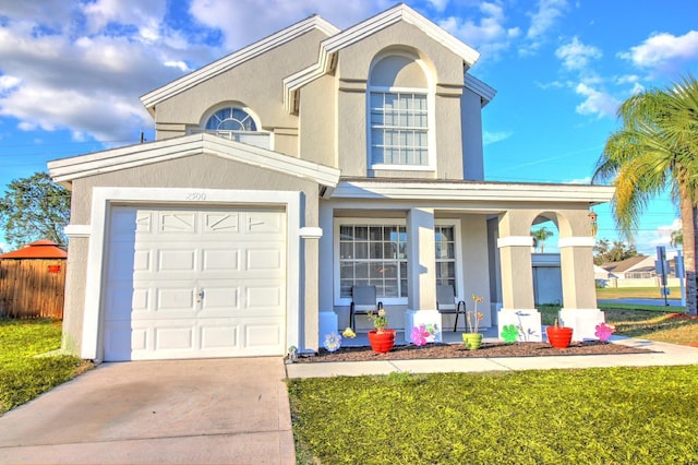 view of front of house with a front lawn and a garage