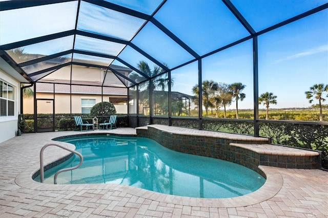 view of pool featuring a patio and a lanai