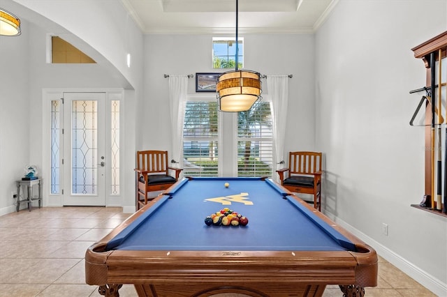 playroom featuring light tile patterned floors, ornamental molding, billiards, and a towering ceiling