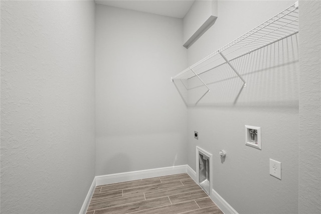 laundry area featuring hookup for a washing machine, wood-type flooring, gas dryer hookup, and hookup for an electric dryer