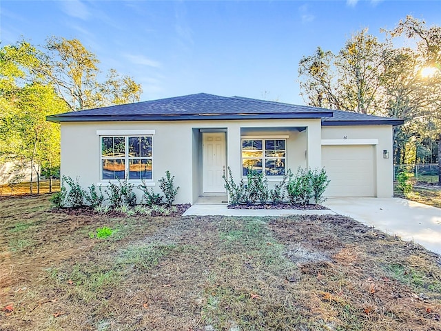 view of front of property with a garage