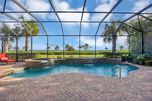 view of swimming pool featuring an in ground hot tub, pool water feature, glass enclosure, and a patio area