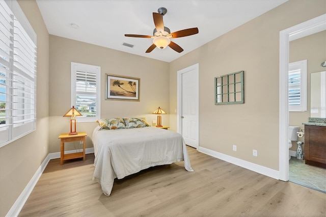 bedroom with ceiling fan and light wood-type flooring