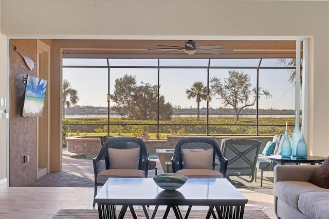 sunroom / solarium with ceiling fan