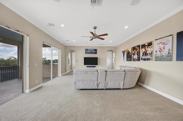 unfurnished living room featuring light carpet, ornamental molding, and ceiling fan