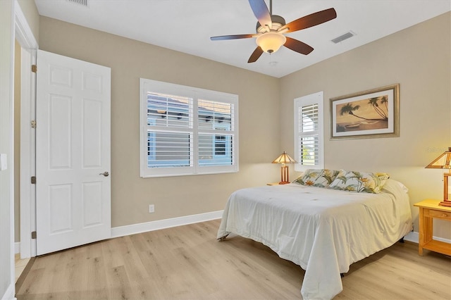 bedroom with light wood-type flooring and ceiling fan