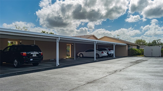 view of vehicle parking with a carport