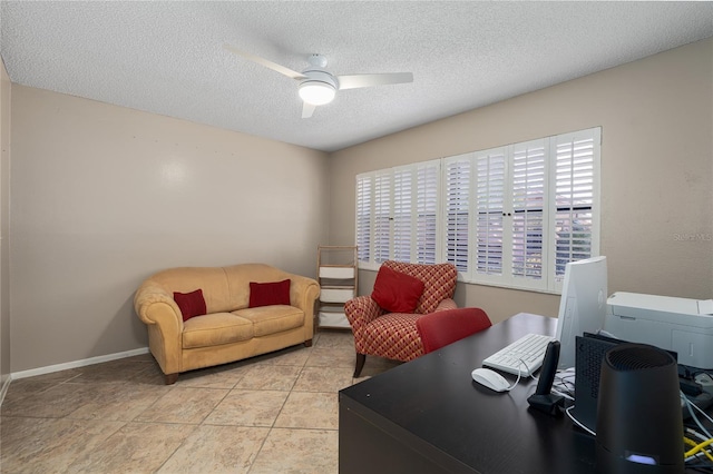 tiled office space with a textured ceiling, plenty of natural light, and ceiling fan