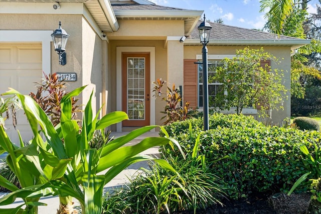 property entrance with a garage