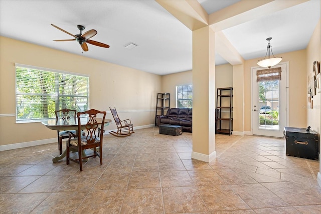 dining space featuring ceiling fan and plenty of natural light