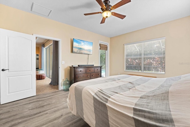 bedroom featuring light hardwood / wood-style floors and ceiling fan