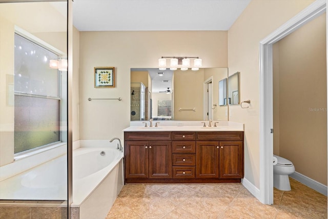 full bathroom featuring vanity, separate shower and tub, toilet, and tile patterned flooring