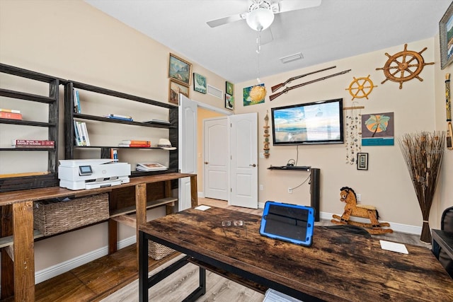 office with ceiling fan and hardwood / wood-style floors