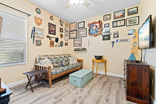 sitting room with light hardwood / wood-style flooring and ceiling fan