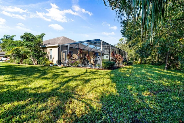 view of yard with glass enclosure