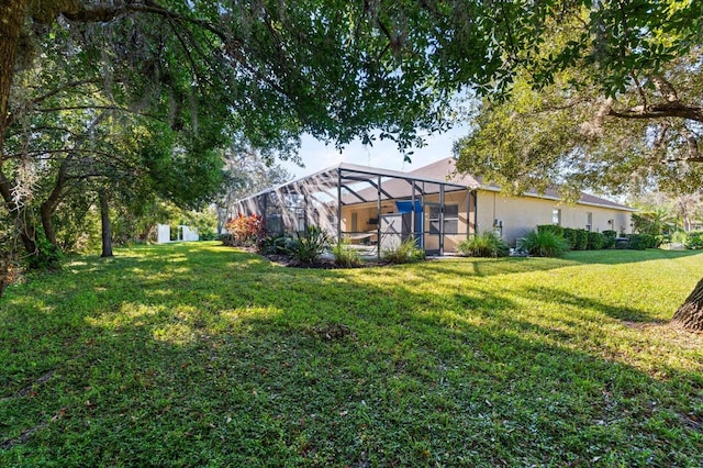 view of yard featuring a lanai