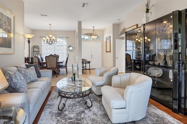 living room with an inviting chandelier