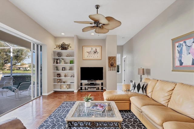 living room with parquet flooring and ceiling fan