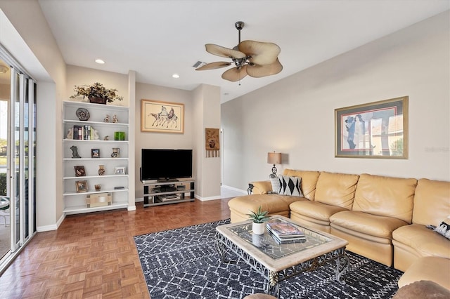 living room featuring parquet flooring and ceiling fan