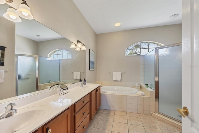 bathroom featuring vanity, a healthy amount of sunlight, tile patterned floors, and separate shower and tub