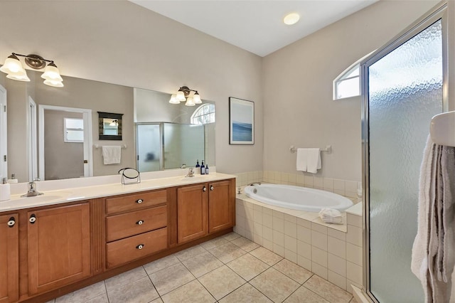 bathroom featuring vanity, tile patterned floors, and separate shower and tub