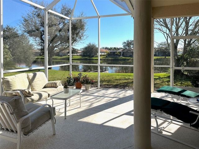 sunroom / solarium with a water view