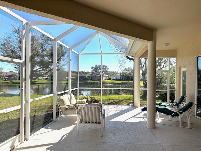 unfurnished sunroom with a water view