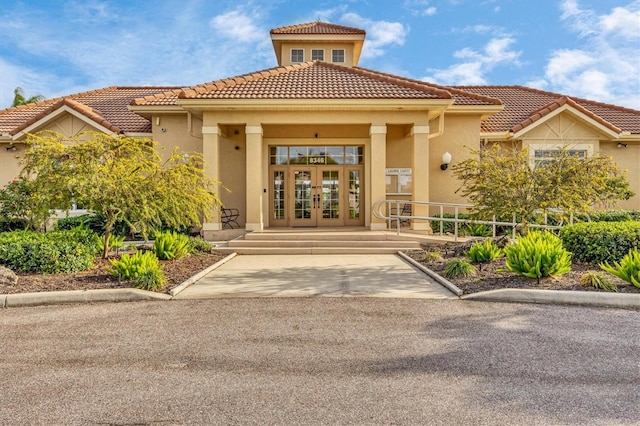 property entrance featuring french doors