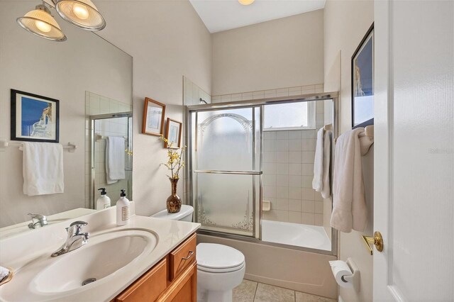 2921 Seasons Blvd, Sarasota, FL 34240 - bathroom with vanity, tile patterned flooring, and bath / shower combo with glass door