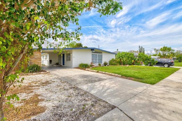 ranch-style home with a front lawn