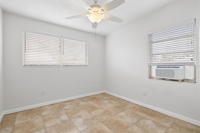 unfurnished room with ceiling fan