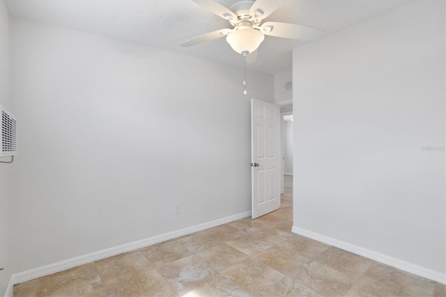 unfurnished room with ceiling fan