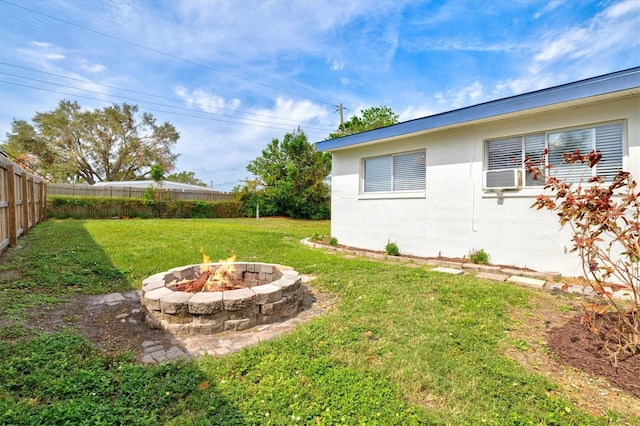 view of yard with an outdoor fire pit