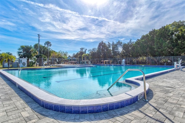 view of swimming pool with a patio