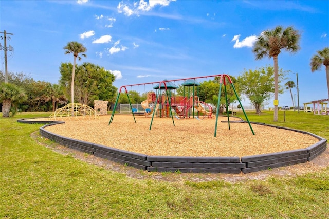 view of playground with a lawn