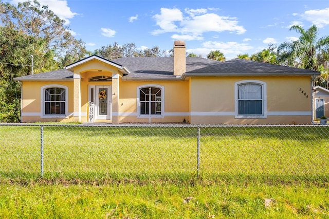 ranch-style house with a front yard