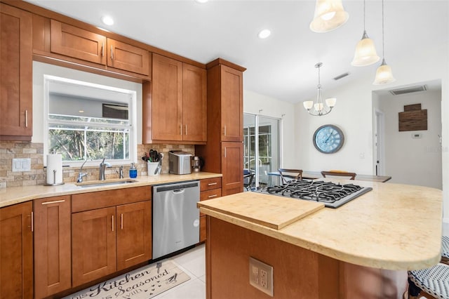 kitchen featuring a kitchen breakfast bar, a kitchen island, stainless steel appliances, and tasteful backsplash