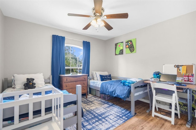 bedroom featuring ceiling fan and hardwood / wood-style flooring