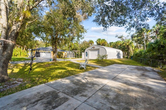 view of front of house featuring a garage and a front lawn