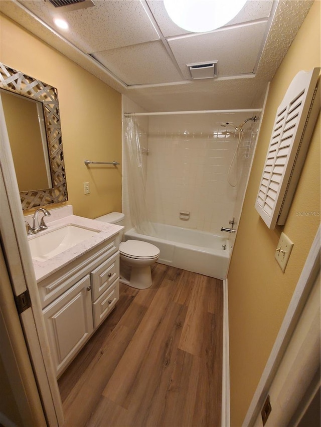 full bathroom with toilet, vanity, shower / tub combo, and hardwood / wood-style flooring