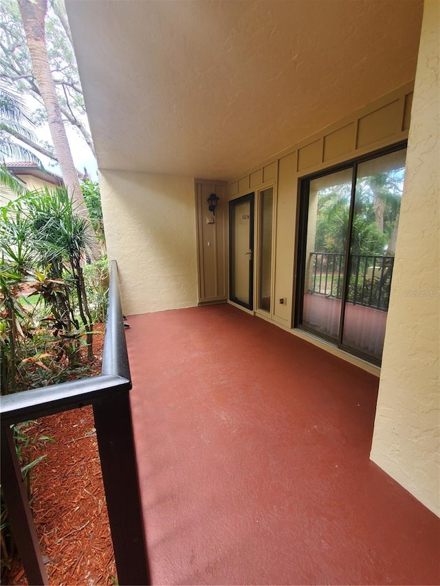 view of patio featuring a balcony