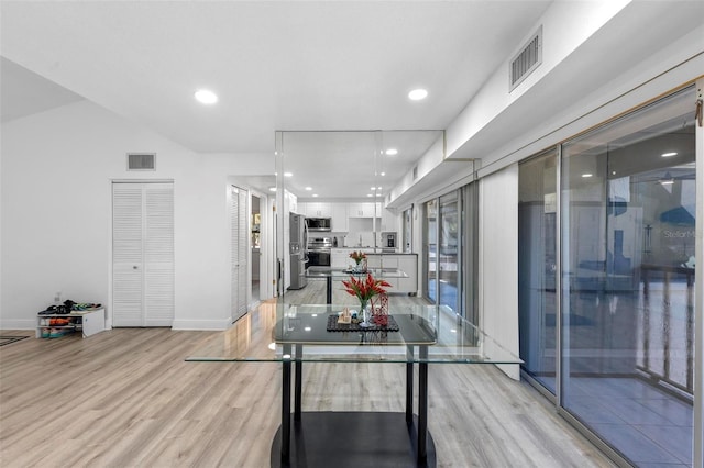 dining space featuring light hardwood / wood-style floors